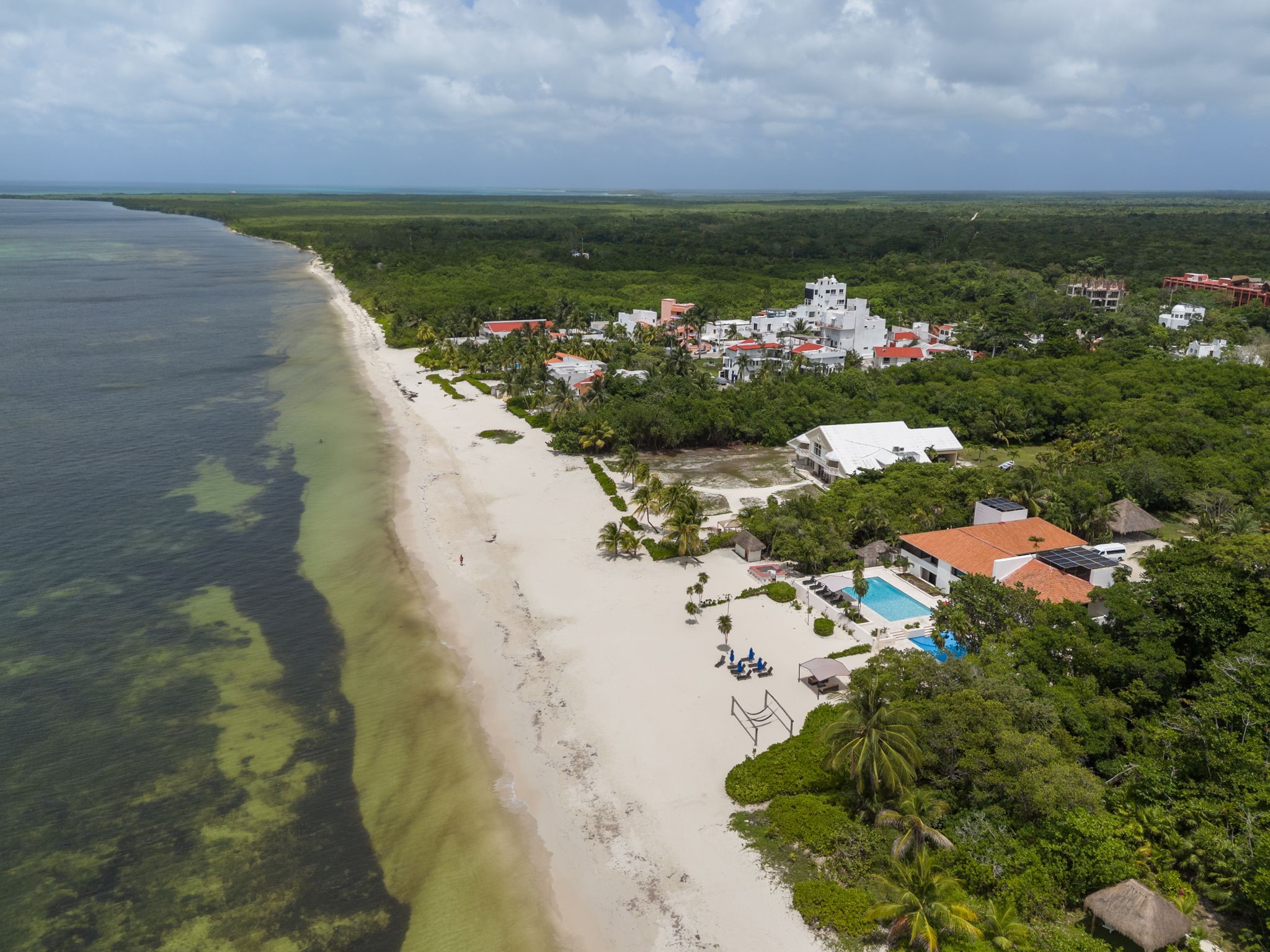 6 Country Club, Unit 4 Nome, TX 77629 - Photo 38 of 45 This spectacular coastal perspective highlights Cozumel's pristine white-sand shoreline, offering an incredible setting for tranquil seaside living.