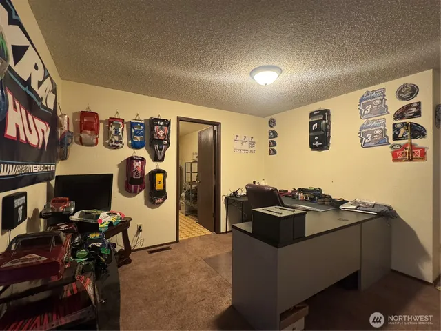 a kitchen with a refrigerator and a stove
