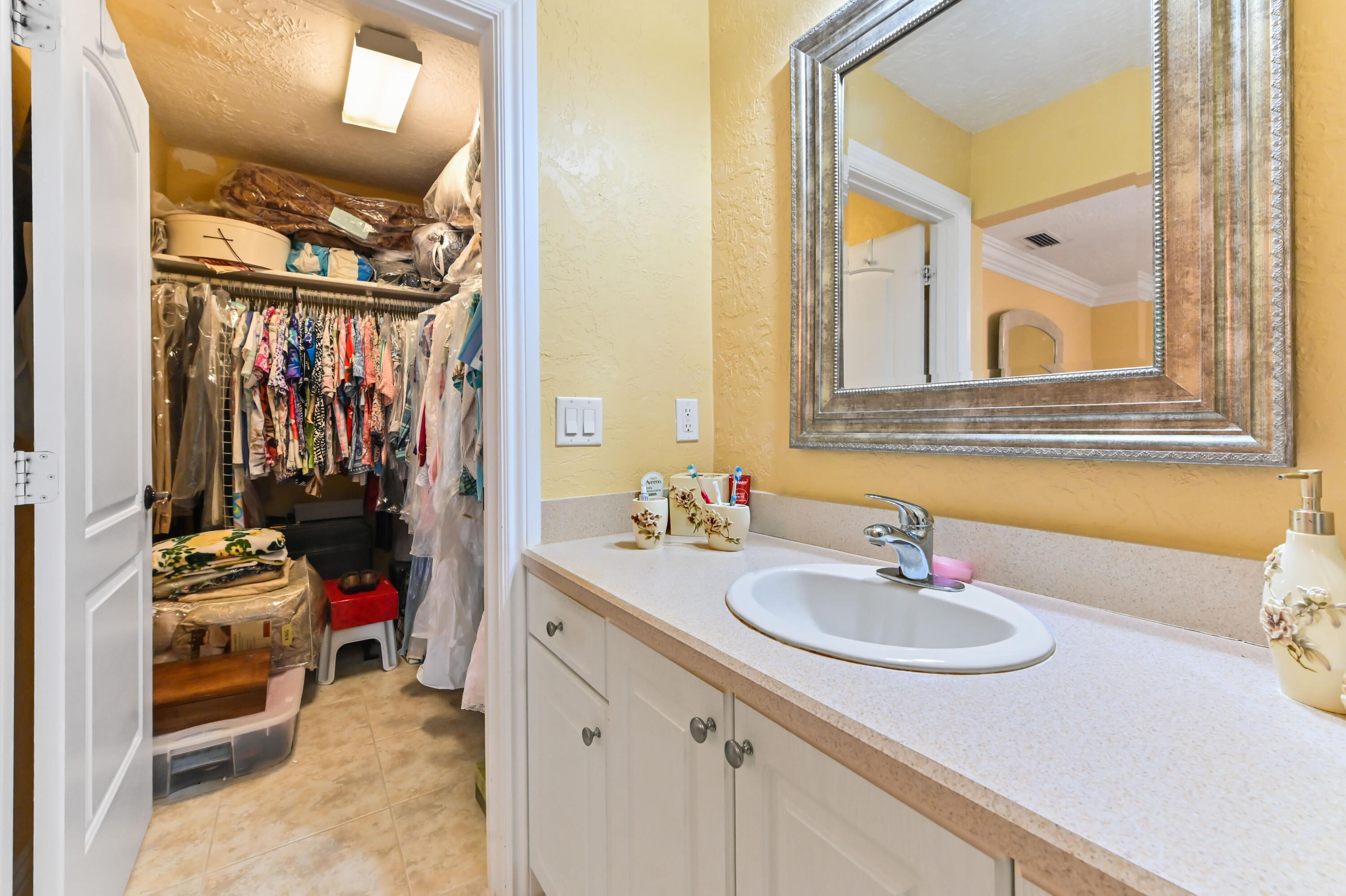 1100 Summer Street, Unit 1 Palm Springs, FL 33461 - Photo 16 of 34 a bathroom with a sink and a mirror