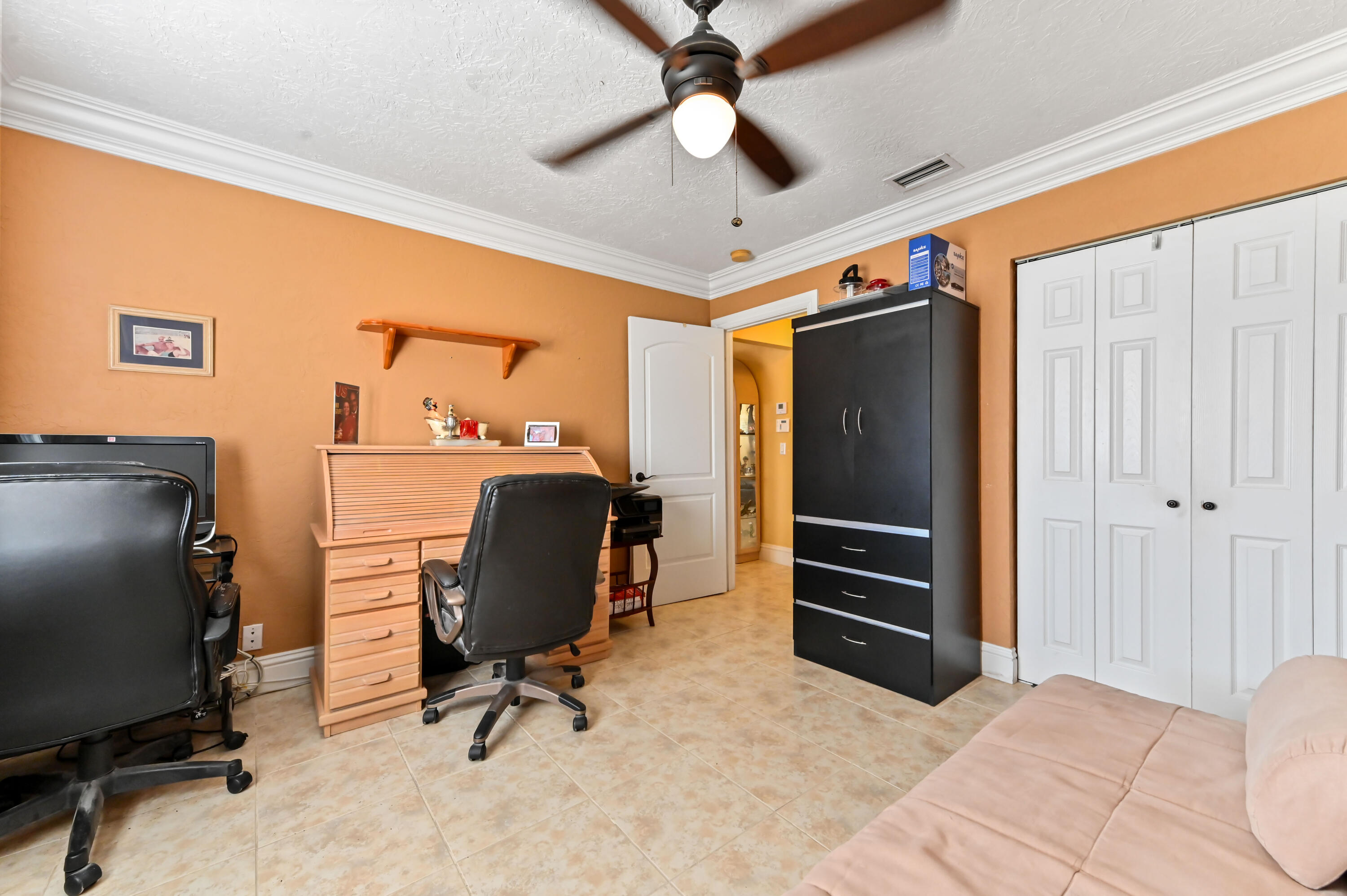 1100 Summer Street, Unit 1 Palm Springs, FL 33461 - Photo 17 of 34 a view of a workspace with furniture and a window