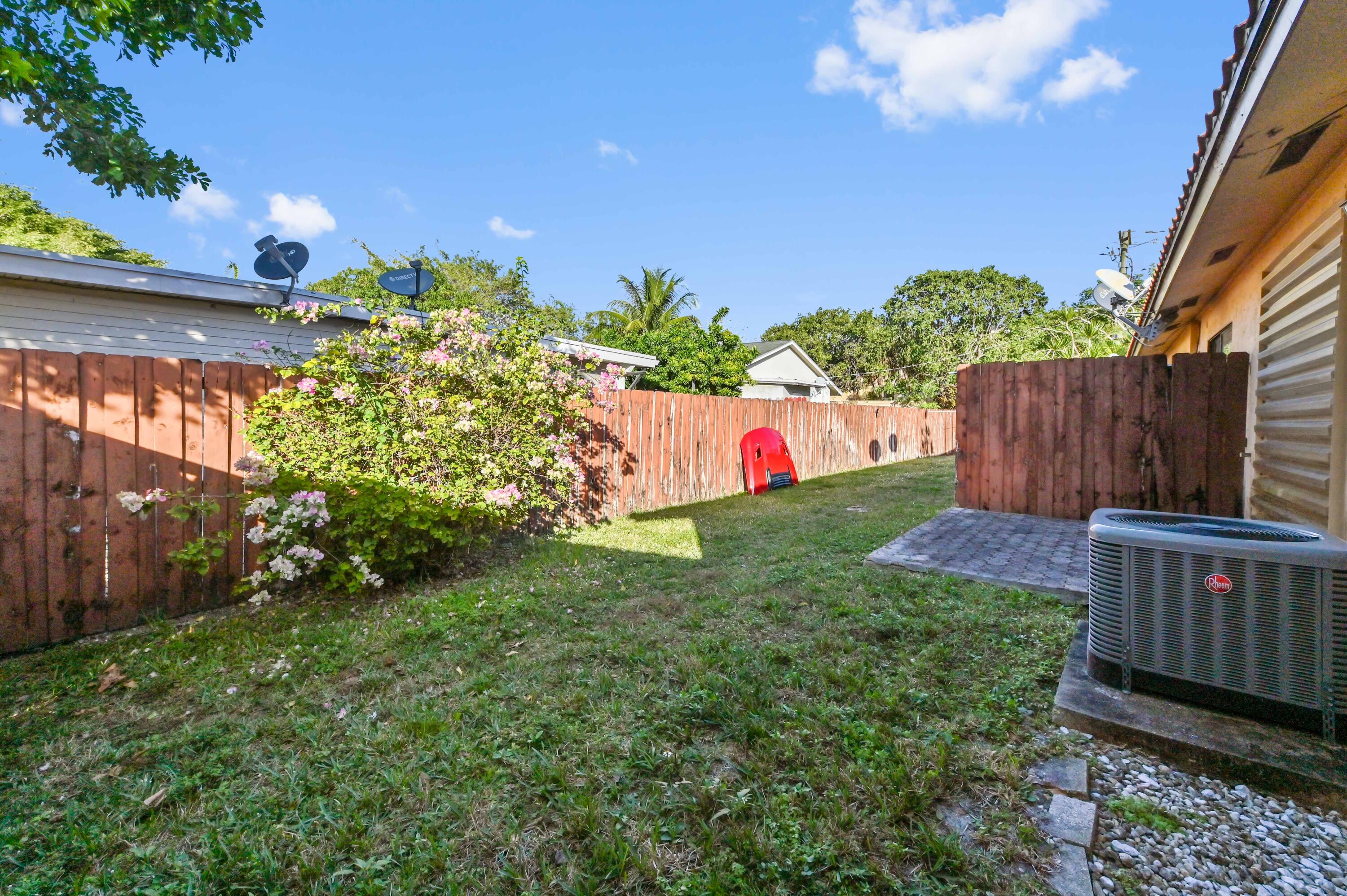 1100 Summer Street, Unit 1 Palm Springs, FL 33461 - Photo 22 of 34 a view of a backyard with a garden
