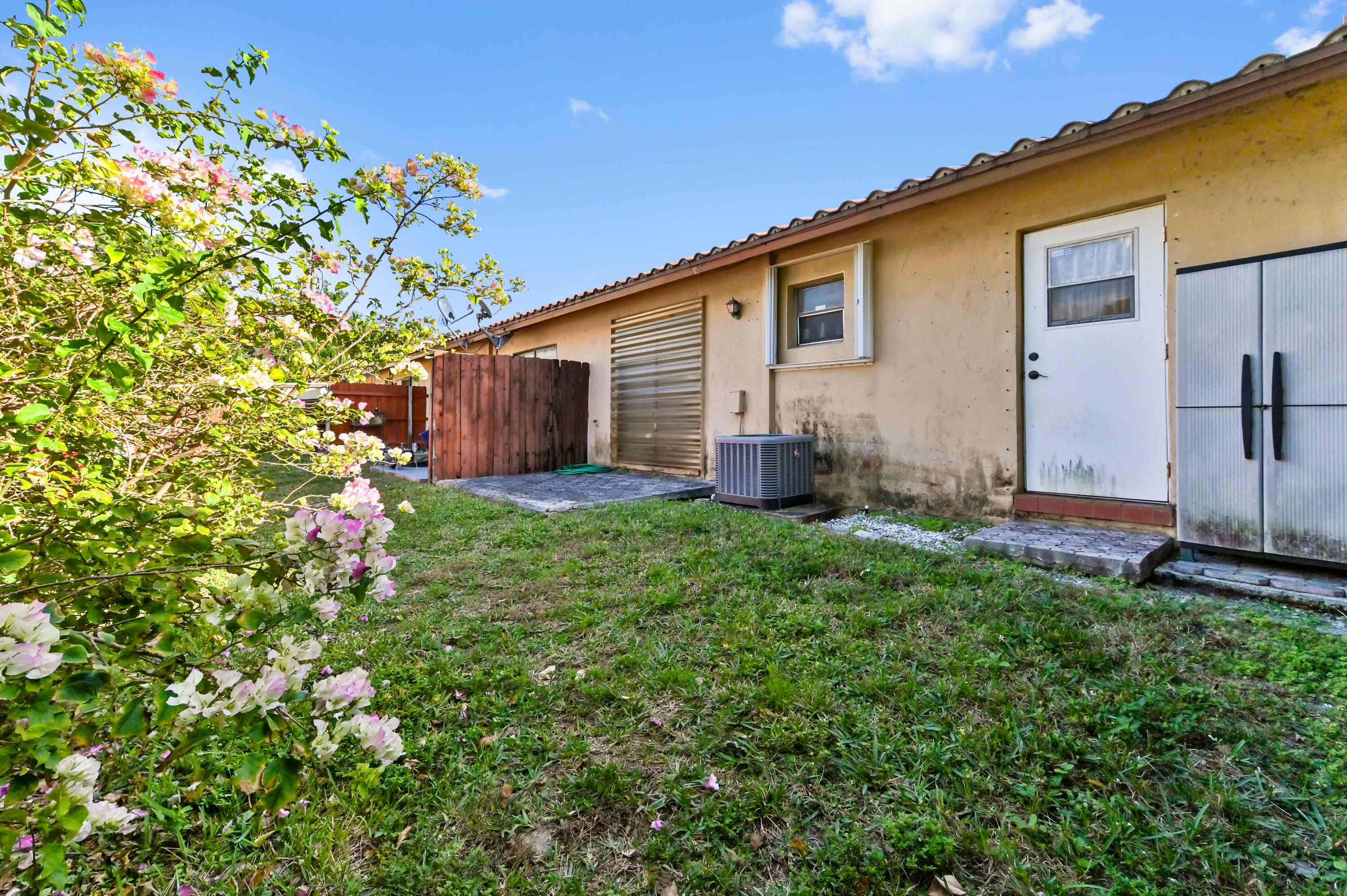 1100 Summer Street, Unit 1 Palm Springs, FL 33461 - Photo 23 of 34 a view of a house with a yard