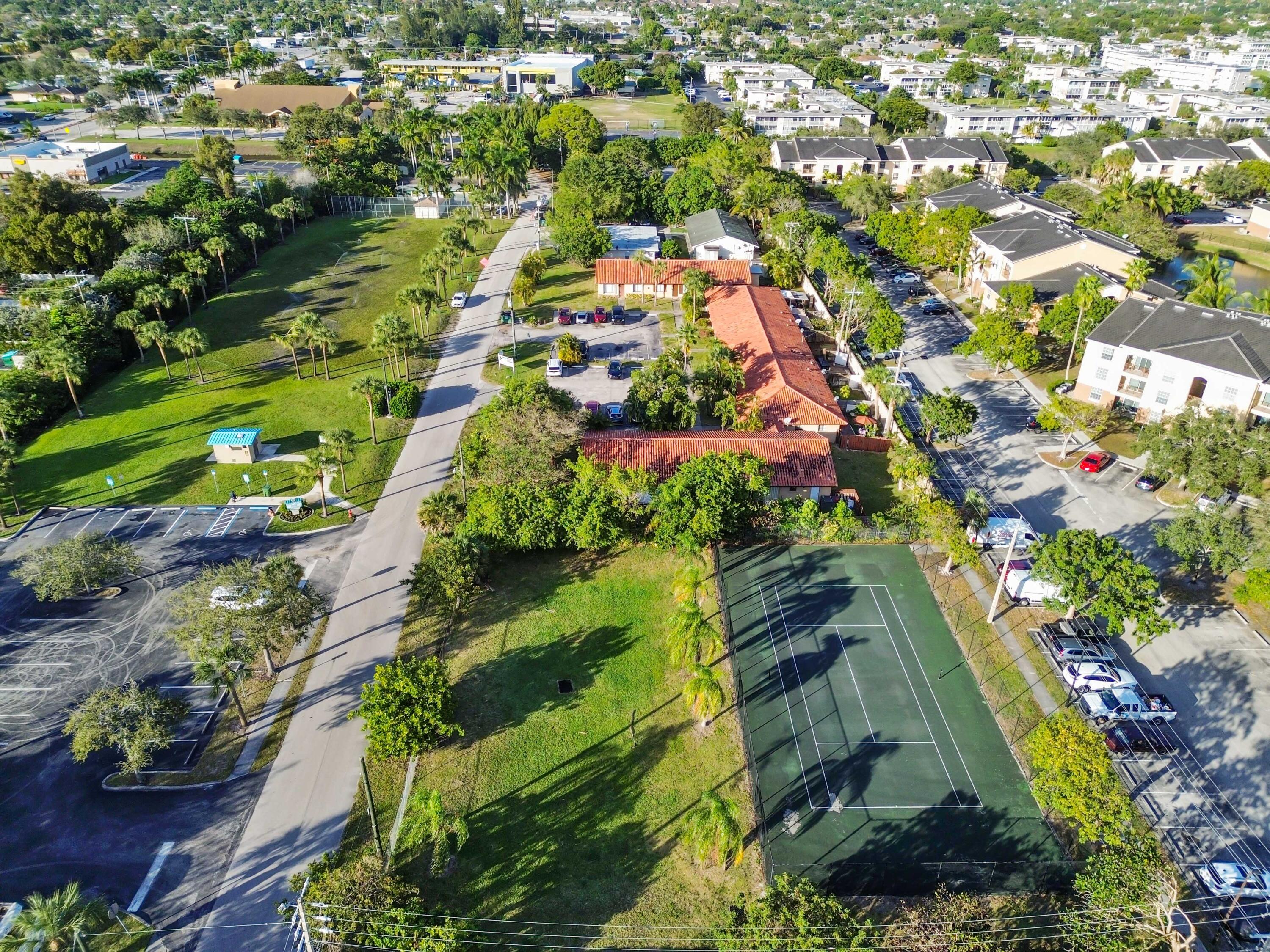 1100 Summer Street, Unit 1 Palm Springs, FL 33461 - Photo 32 of 34 an aerial view of residential houses with outdoor space