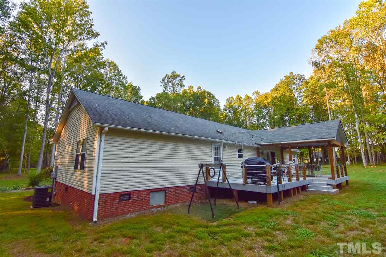 727 Ned Moore Road Timberlake, NC 27583 - Photo 14 of 24 a view of a house with a yard