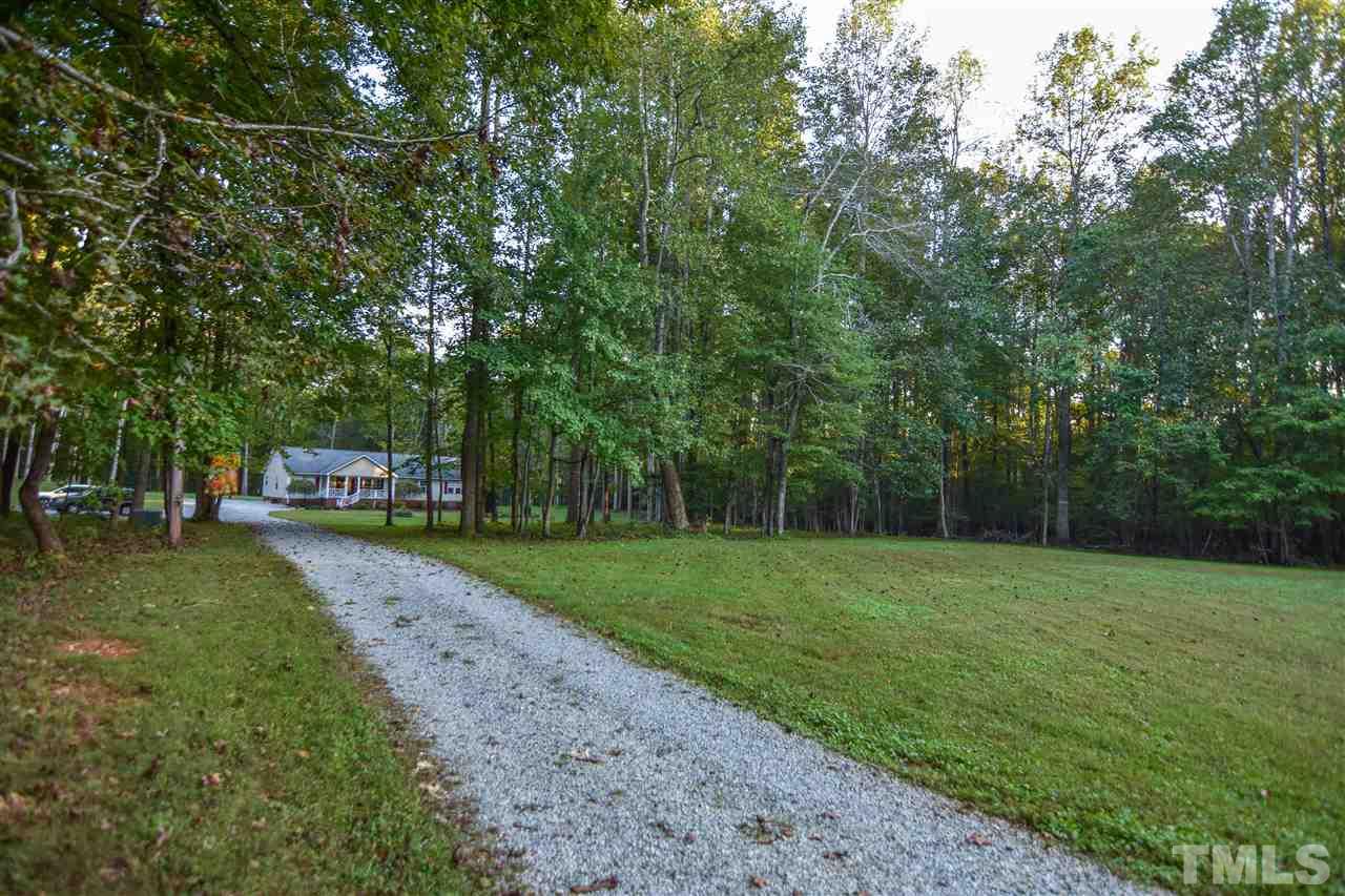 727 Ned Moore Road Timberlake, NC 27583 - Photo 22 of 24 a view of a park with large trees