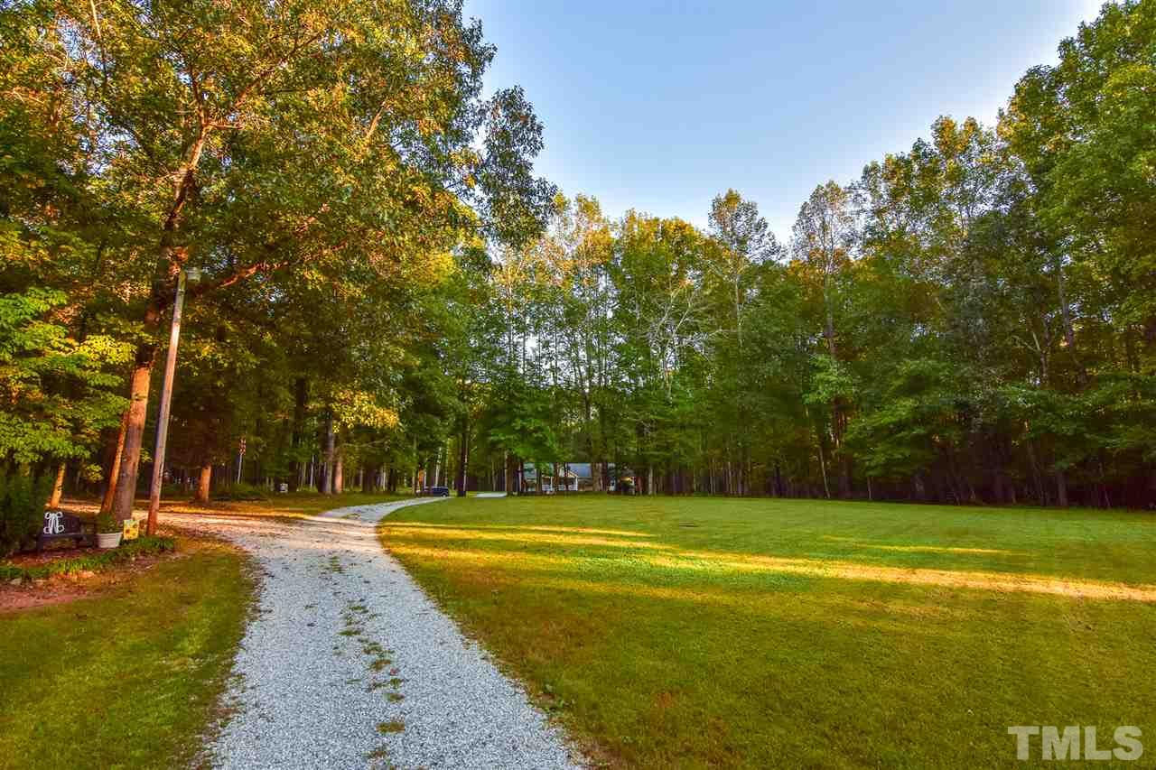 727 Ned Moore Road Timberlake, NC 27583 - Photo 23 of 24 a view of swimming pool with trees