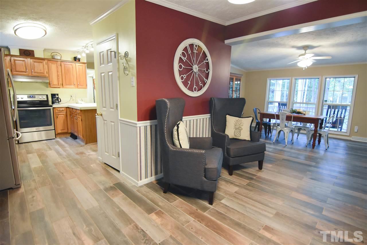 727 Ned Moore Road Timberlake, NC 27583 - Photo 4 of 24 a living room with furniture and a table
