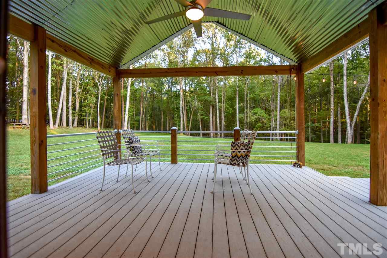 727 Ned Moore Road Timberlake, NC 27583 - Photo 5 of 24 a view of a house with a backyard