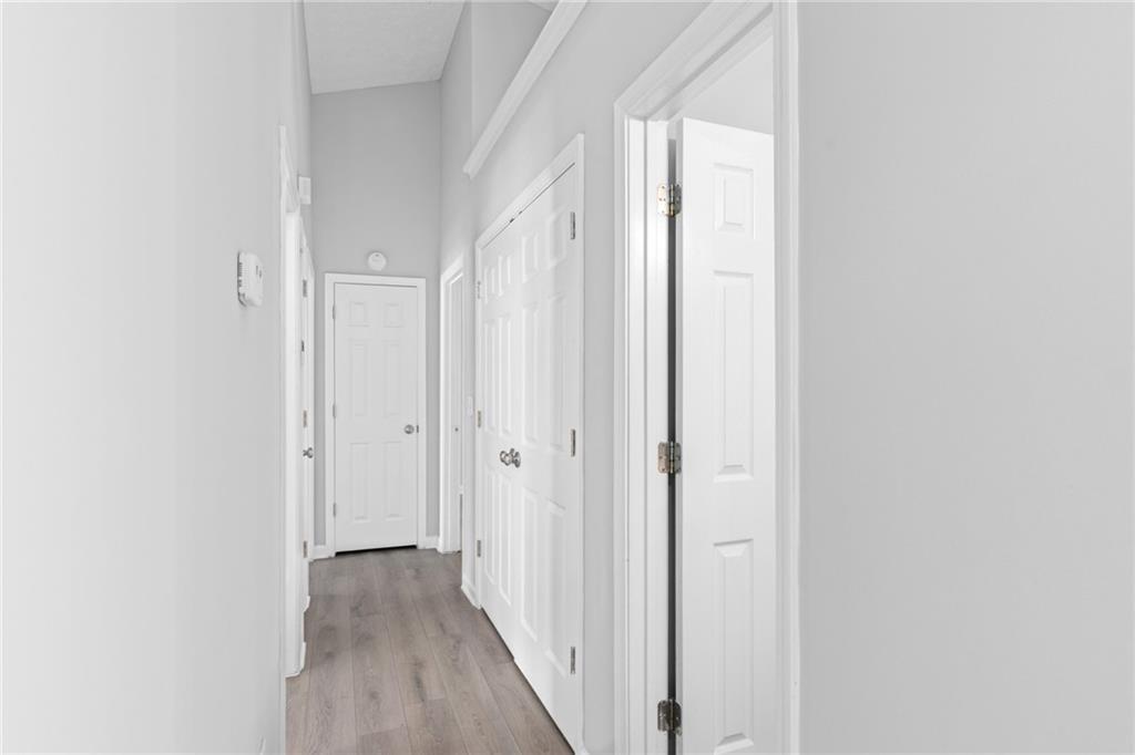 2110 Racquet Club Circle Northwest Lawrenceville, GA 30043 - Photo 14 of 44 a view of a hallway with wooden floor