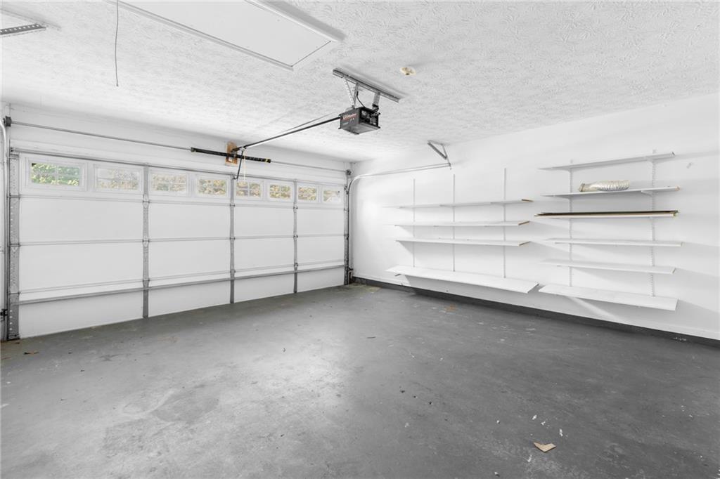 2110 Racquet Club Circle Northwest Lawrenceville, GA 30043 - Photo 32 of 44 a view of a store room cabinets and empty racks