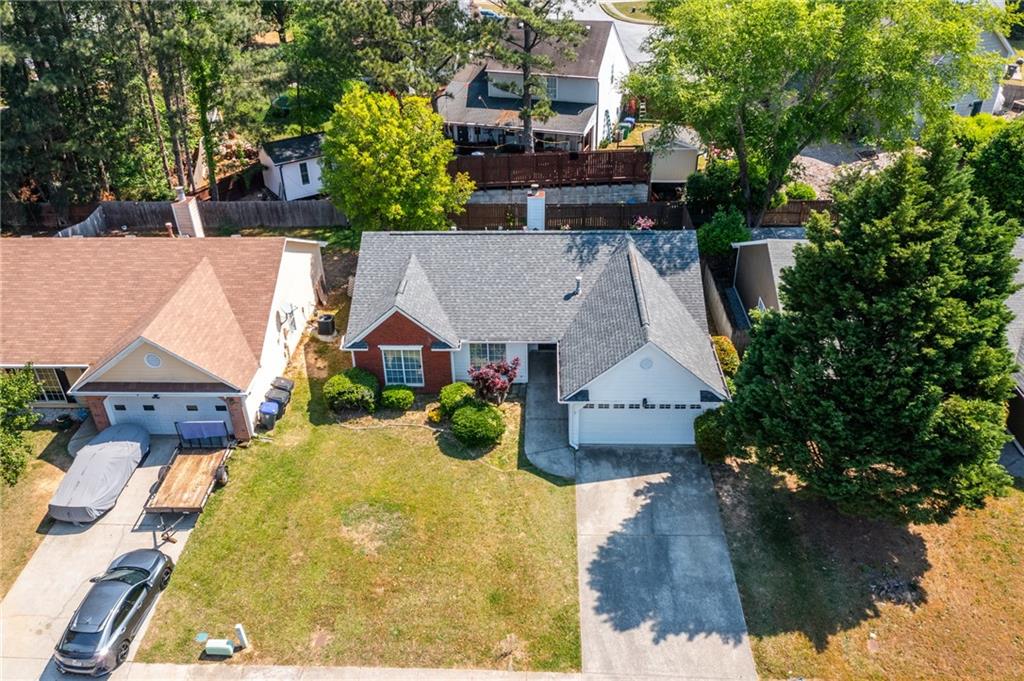 2110 Racquet Club Circle Northwest Lawrenceville, GA 30043 - Photo 38 of 44 an aerial view of a house with swimming pool and large trees