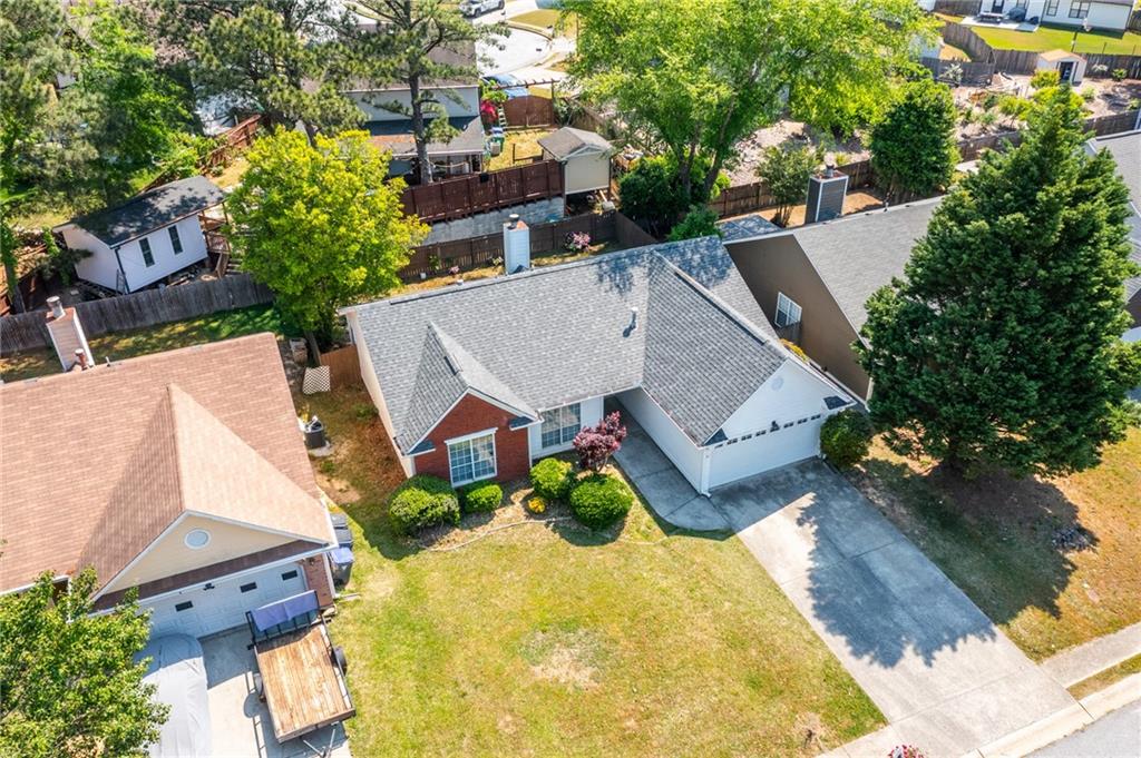 2110 Racquet Club Circle Northwest Lawrenceville, GA 30043 - Photo 39 of 44 an aerial view of a house with swimming pool and large trees