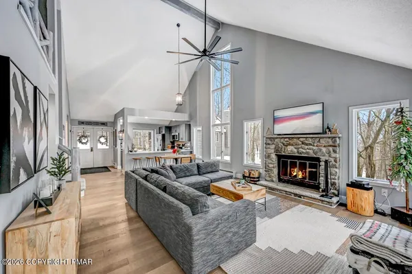 a living room with furniture and a fireplace