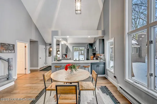 a kitchen with stainless steel appliances granite countertop a sink and a refrigerator