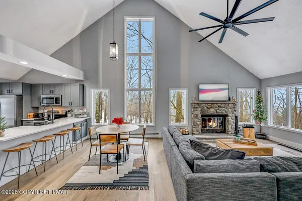 a living room with fireplace furniture and a fireplace