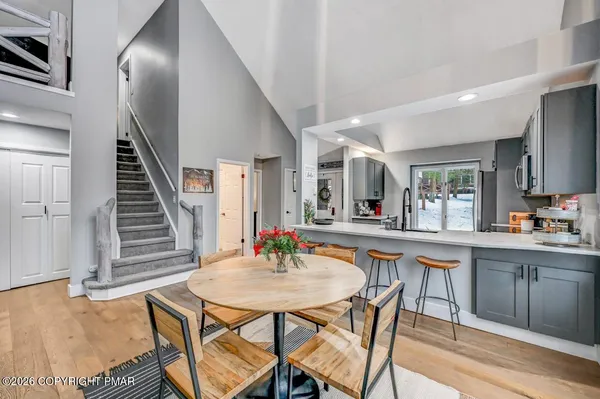 a kitchen view with stainless steel appliances a refrigerator and a sink