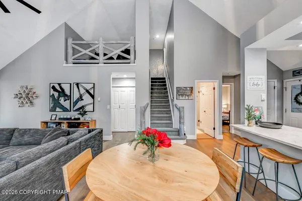 a kitchen with stainless steel appliances granite countertop a refrigerator stove and sink