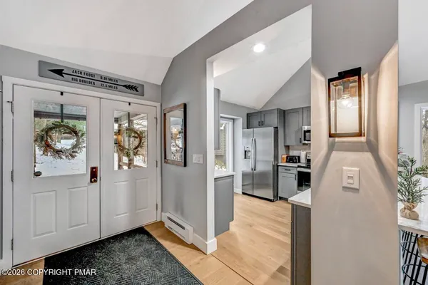 a living room with furniture windows and a fireplace
