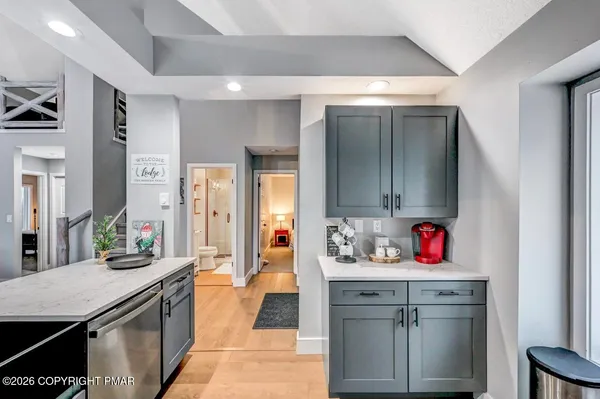 a spacious bedroom with a bed and window
