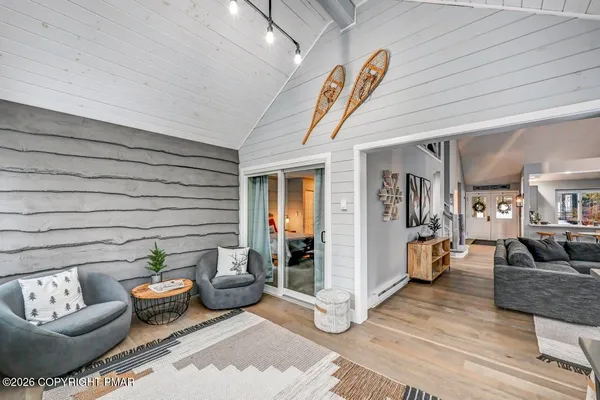 a bathroom with a shower toilet and sink