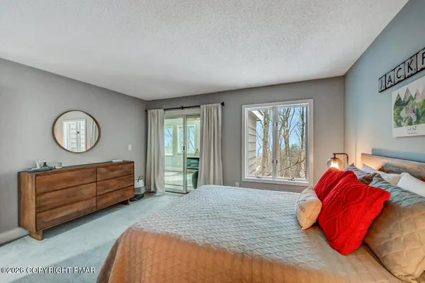 a bedroom with furniture and a couch