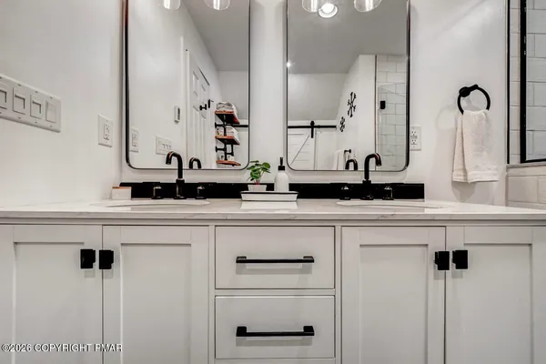 a bedroom with furniture and baby crib