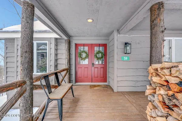 a living room with furniture fireplace and flat screen tv