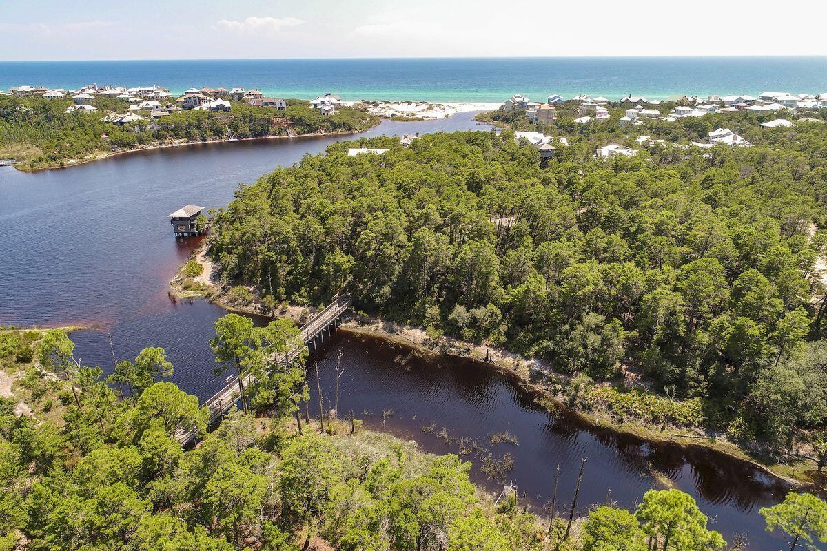 8-9 Sinclair Lane Santa Rosa Beach, FL 32459 - Photo 14 of 21 an aerial view of residential houses with outdoor space and lake view