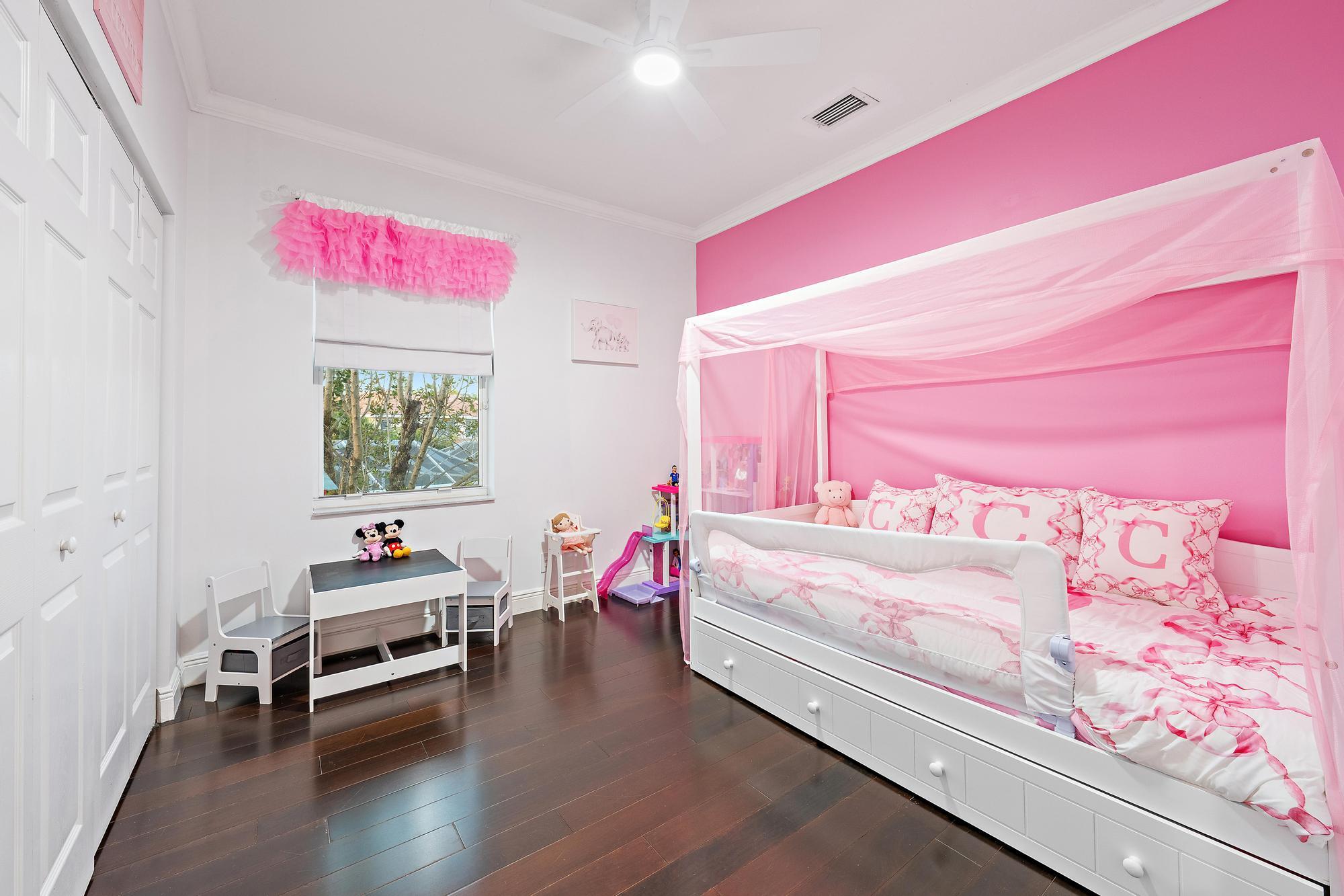 265 Swallowtail Lane Jupiter, FL 33458 - Photo 19 of 37 a bed room with a bed and a chair