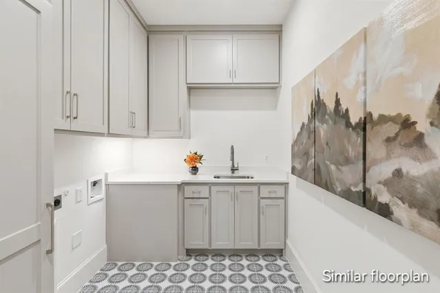 a kitchen with a sink and cabinets