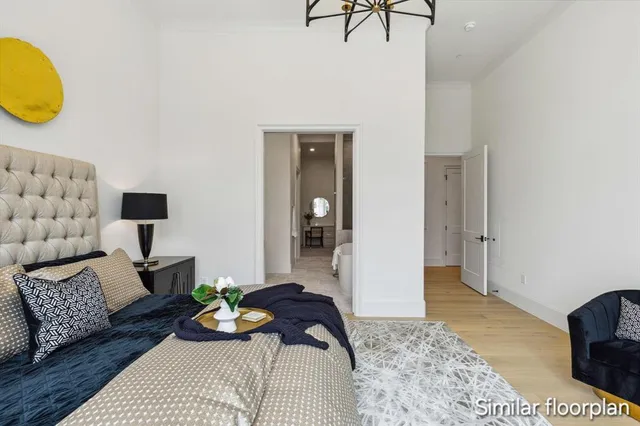 a bedroom with bed and a couch