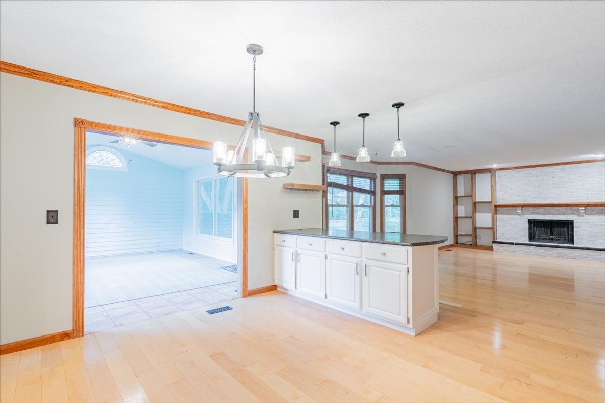 10 Inverness Drive Bloomington, IL 61701 - Photo 11 of 43 a view of a kitchen with a sink and a chandelier