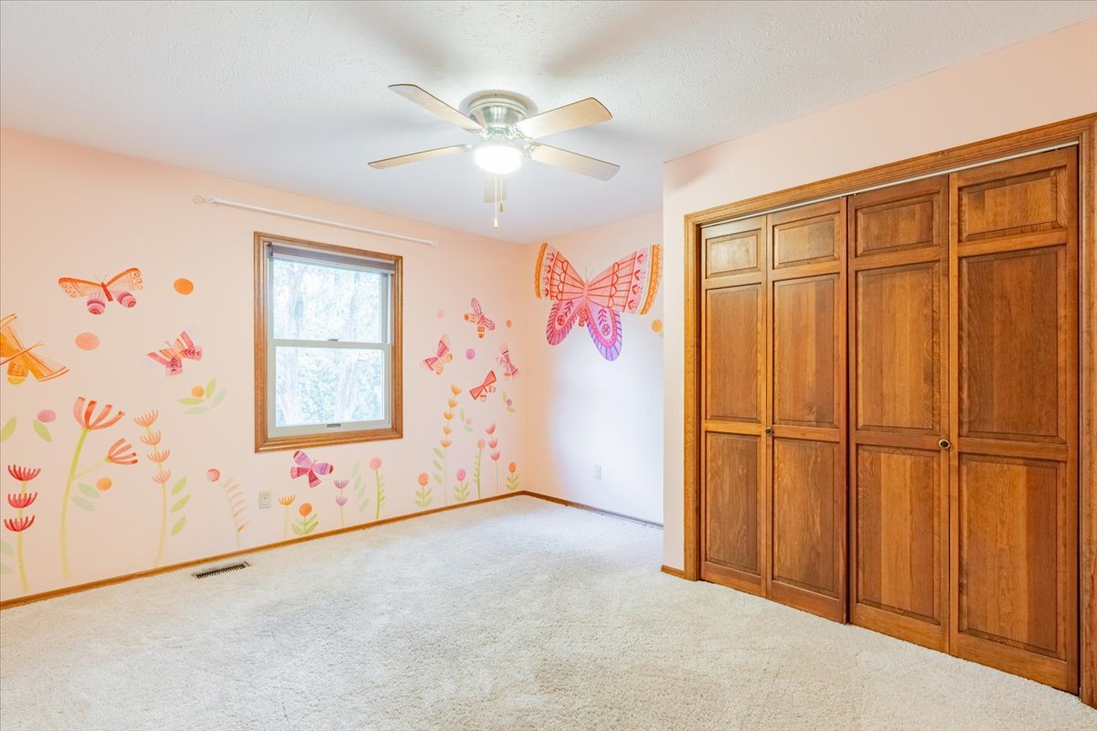 10 Inverness Drive Bloomington, IL 61701 - Photo 25 of 43 an empty room with windows and fan