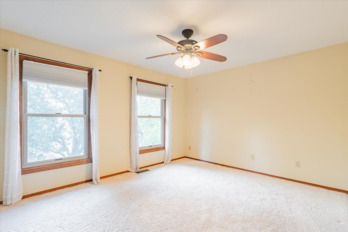 10 Inverness Drive Bloomington, IL 61701 - Photo 29 of 43 an empty room with windows and fan