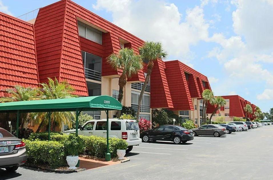 22615 Southwest 66th Avenue, Unit 216 Boca Raton, FL 33428 - Photo 1 of 23 a car parked in front of a house