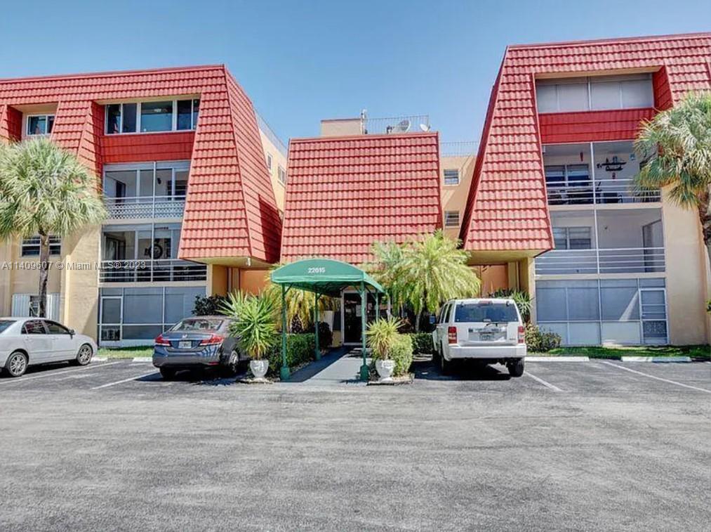 22615 Southwest 66th Avenue, Unit 216 Boca Raton, FL 33428 - Photo 2 of 23 a car parked in front of a house