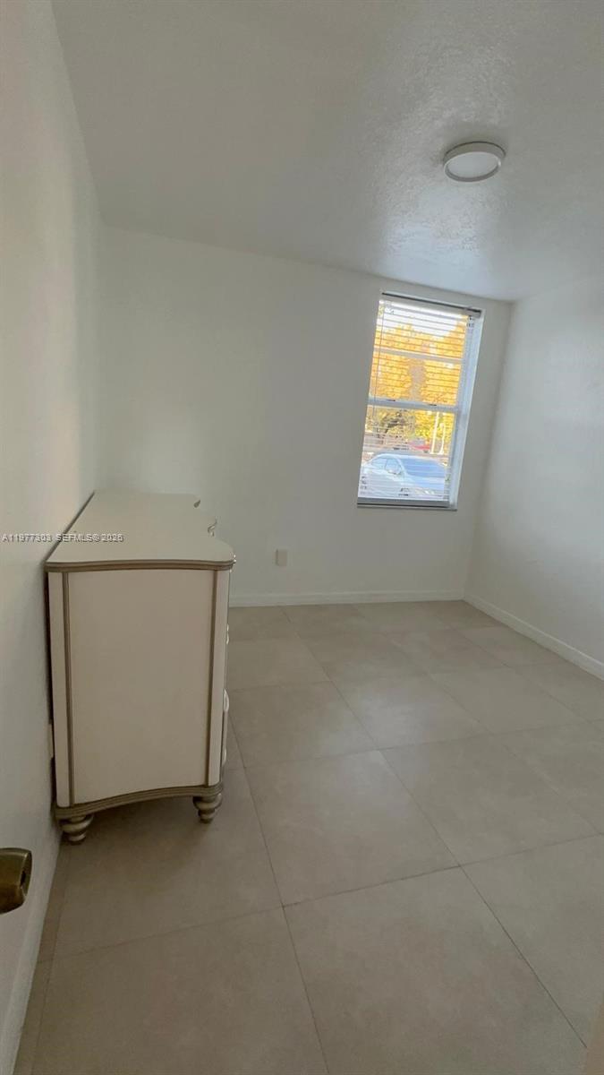 1885 West 56th Street, Unit 112 Hialeah, FL 33012 - Photo 5 of 11 a view of an empty room