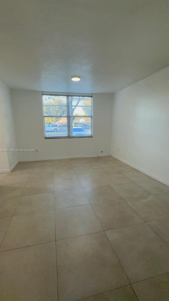 1885 West 56th Street, Unit 112 Hialeah, FL 33012 - Photo 10 of 11 an empty room with windows