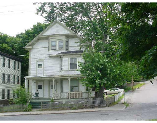 90-92 Transit Street Woonsocket, RI 02895 - Photo 1 of 1 a front view of a house with a yard