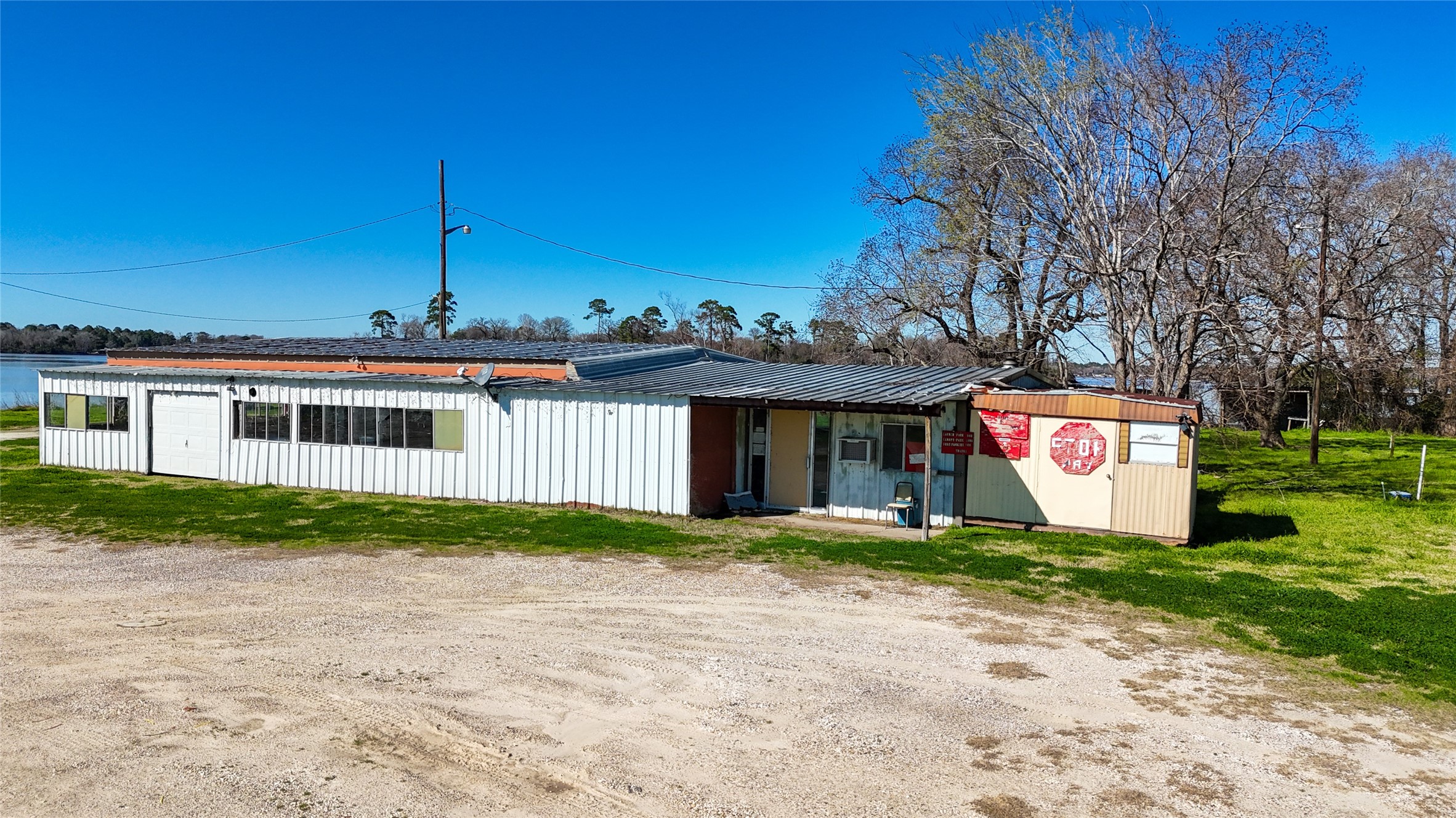 224 Steinback Avenue Trinity, TX 75862 - Photo 12 of 23 a front view of a house with a yard and garage