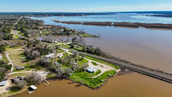 an aerial view of a house with a lake view