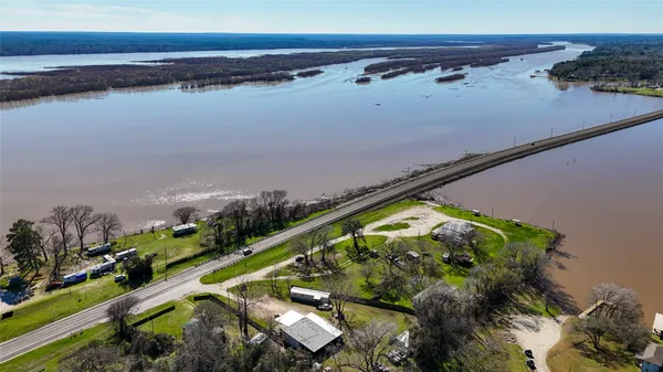 an aerial view of a house with a lake view