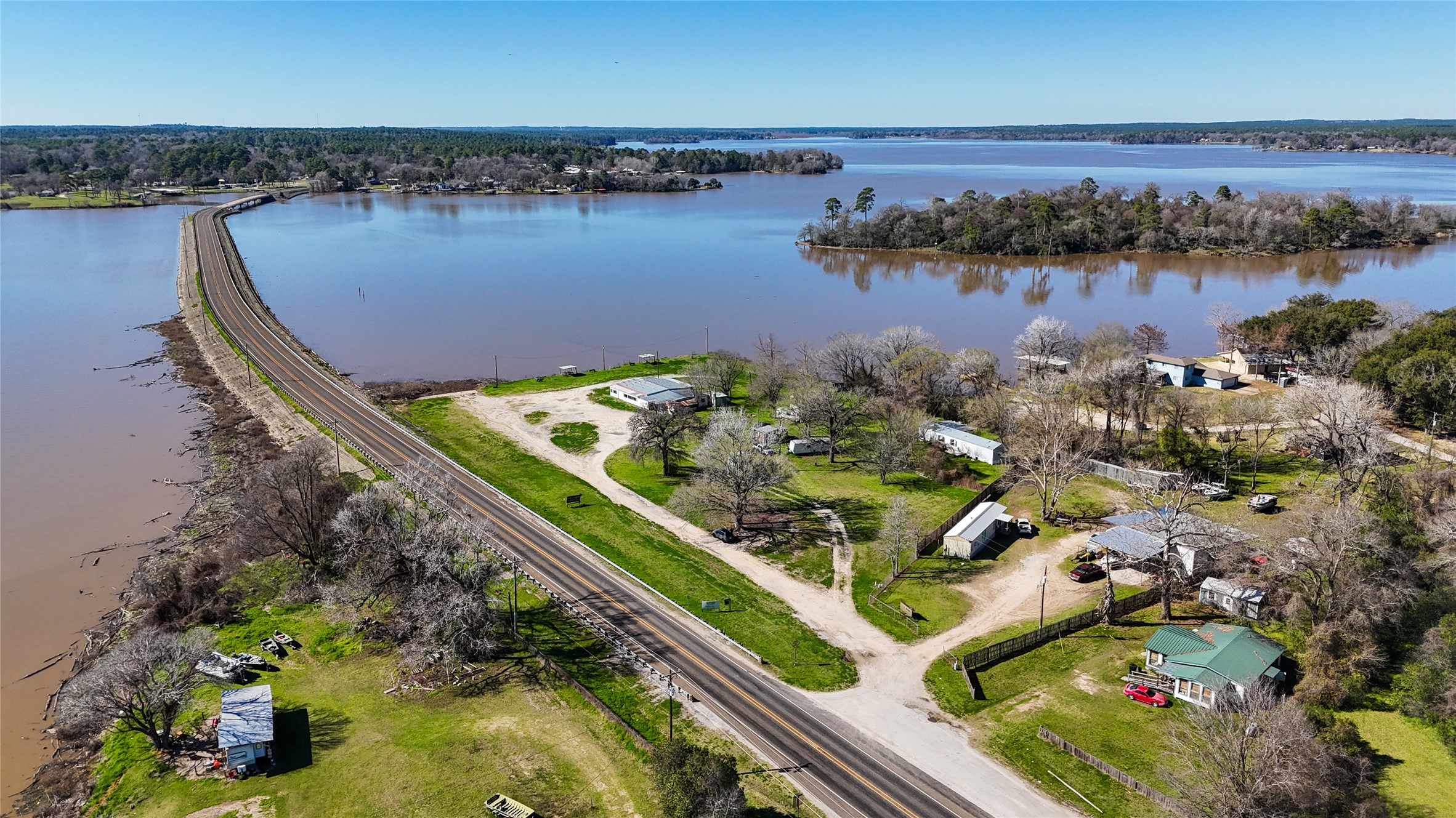 224 Steinback Avenue Trinity, TX 75862 - Photo 22 of 23 an aerial view of a residential houses with outdoor space and lake view