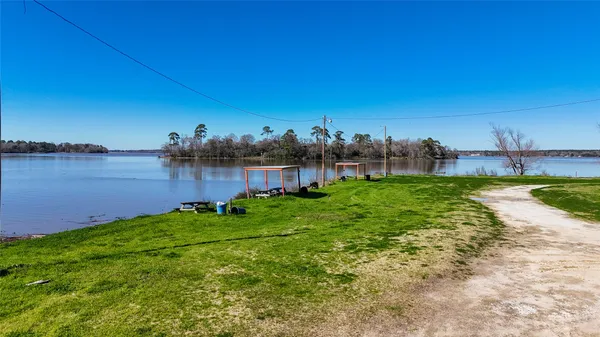 a view of a lake with houses in the back