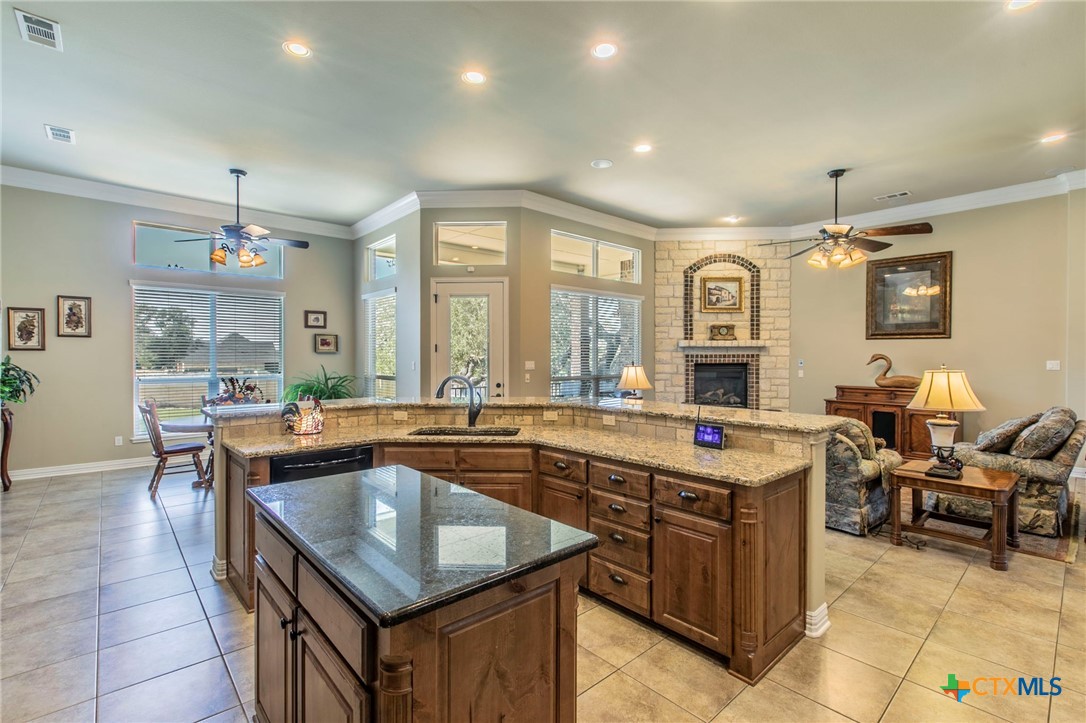 1735 Alta Vista Loop Temple, TX 76502 - Photo 12 of 41 Kitchen overlooking the living room w/fireplace