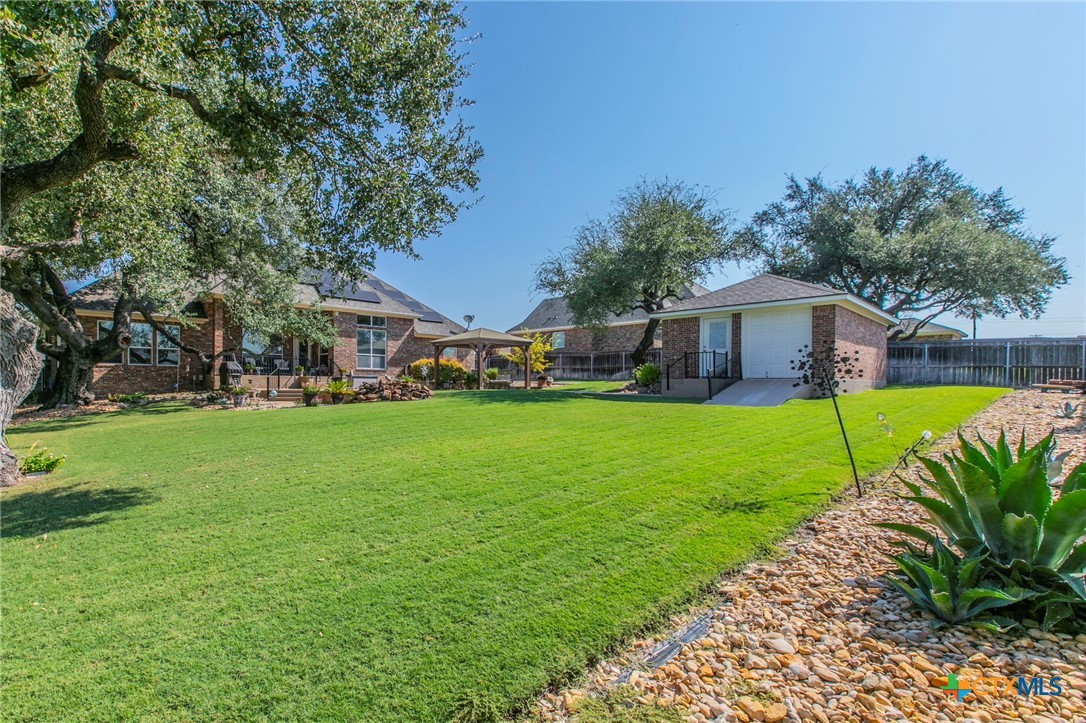 1735 Alta Vista Loop Temple, TX 76502 - Photo 32 of 41 Backyard with large trees