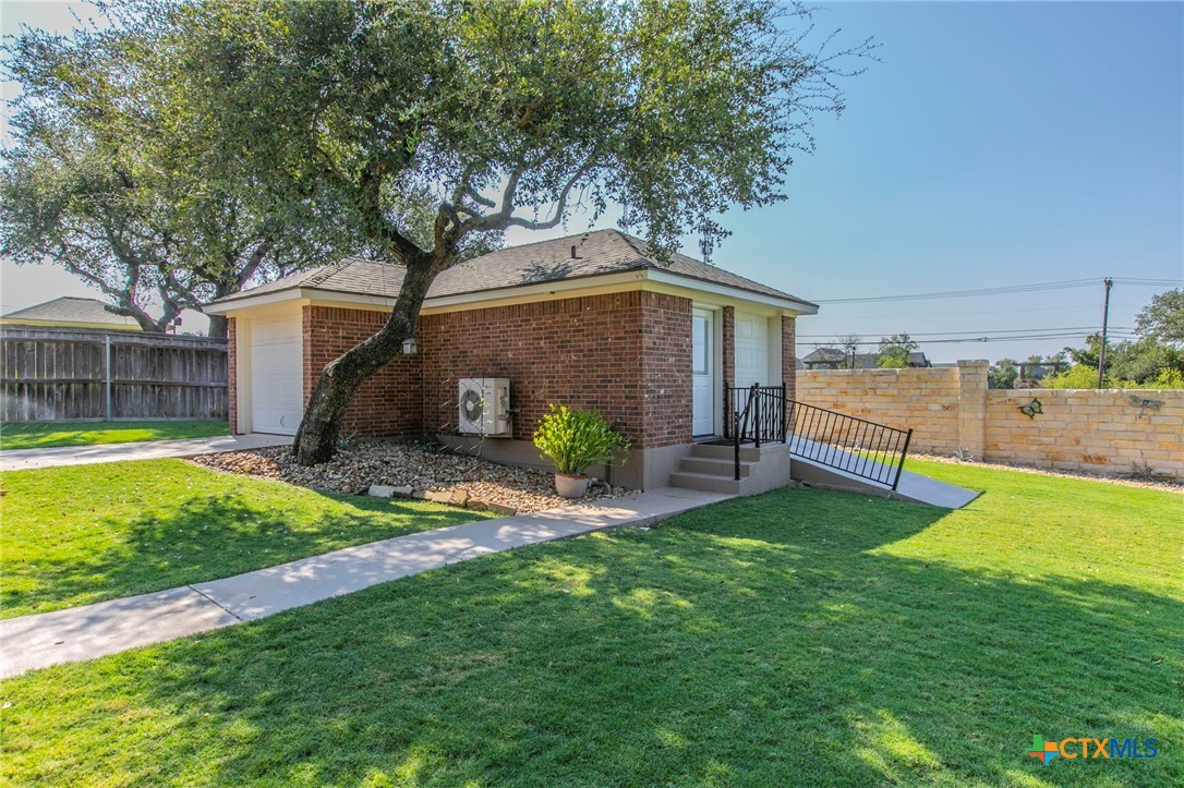 1735 Alta Vista Loop Temple, TX 76502 - Photo 35 of 41 Heated and Cooled Shop/Man Cave with ramp for lawn mower/golf cart