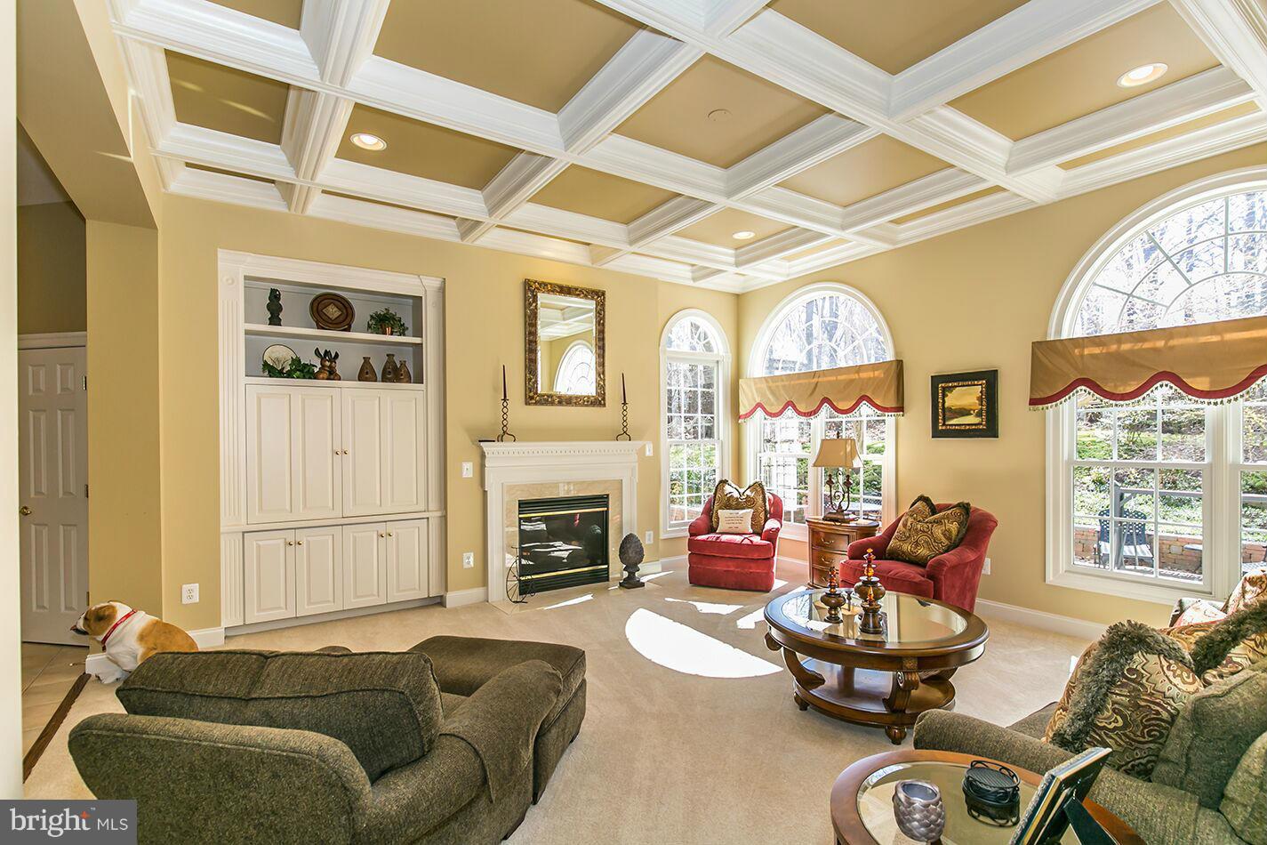 604 Clear Spring Road Great Falls, VA 22066 - Photo 11 of 28 a living room with furniture fireplace and a large window
