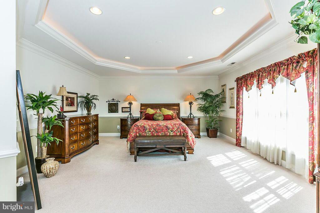 604 Clear Spring Road Great Falls, VA 22066 - Photo 14 of 28 a bedroom with furniture and a book shelf