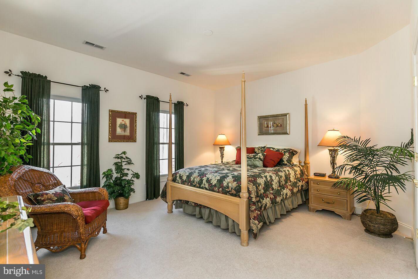 604 Clear Spring Road Great Falls, VA 22066 - Photo 18 of 28 a bed room with a bed and a couch